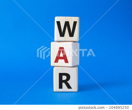War symbol. Wooden cubes with word War. Beautiful blue background. Business and War concept. Copy space. 104895250