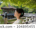A kimono woman standing in a fresh green tourist spot 104895455