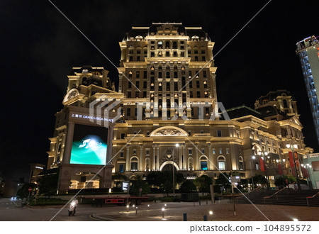 exterior of Grand Lisboa Palace at night. it is the newest casino and hotel in Macau 104895572