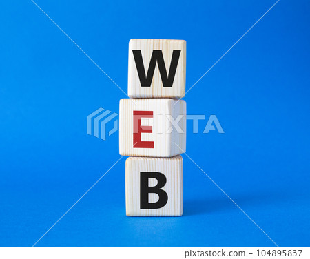 Web symbol. Wooden cubes with word Web. Beautiful blue background. Business and Web concept. Copy space. 104895837