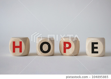Hope symbol. Concept word Hope on wooden cubes. Beautiful white background. Business and Hope concept. Copy space. Hope symbol. Concept word Hope on wooden cubes. Beautiful white background. Business and Hope concept. Copy space. 104895865