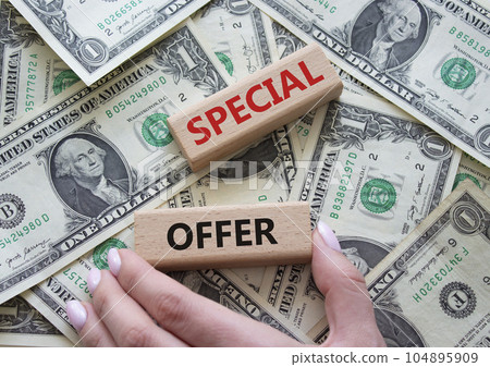 Special offer symbol. Concept word Special offer on wooden blocks. Beautiful dollar background. Businessman hand. Business and Special offer concept. Copy space Special offer symbol. Concept word Special offer on wooden blocks. Beautiful dollar background. Businessman hand. Business and Special offer concept. Copy space 104895909