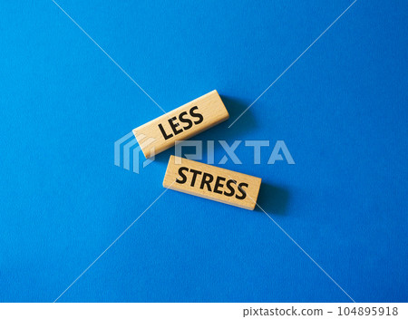 Less stress symbol. Wooden blocks with words Less stress. Beautiful blue background. Healthcare and Less stress concept. Copy space. 104895918