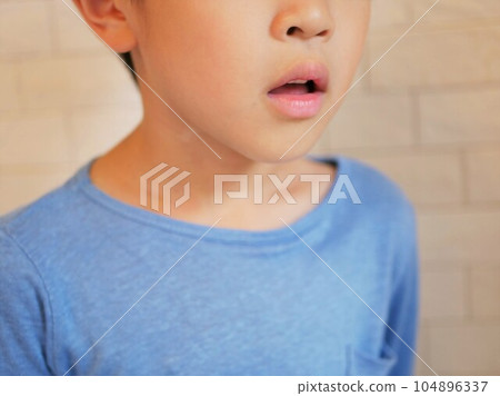 Side profile of a boy with open mouth Side profile of a boy with open mouth 104896337