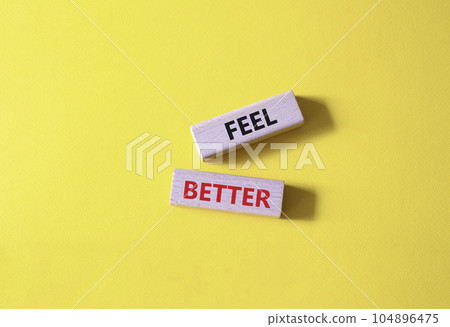 Feel better symbol. Wooden blocks with words Feel better. Beautiful yellow background. Business and Feel better concept. Copy space. Feel better symbol. Wooden blocks with words Feel better. Beautiful yellow background. Business and Feel better concept. Copy space. 104896475