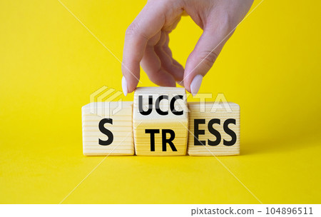 Success vs Stress symbol. Businessman hand turns wooden cubes and changes the word Stress to Success. Beautiful yellow background. Success vs Stress and business concept. Copy space Success vs Stress symbol. Businessman hand turns wooden cubes and changes the word Stress to Success. Beautiful yellow background. Success vs Stress and business concept. Copy space 104896511