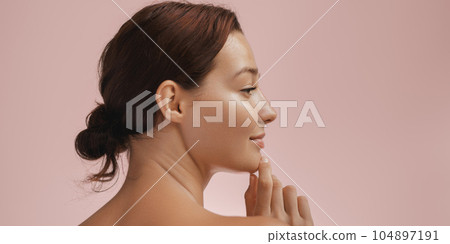 Skin Care and Beauty Concept Photo of Woman with Clean and Healthy Skin Touching Her Face 104897191