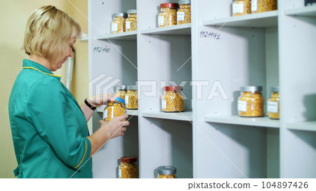 Laboratory research of corn seeds. samples of different species, varieties of selection corn. laboratory for the analysis and diagnosis of grain from the field. the cultivation of corn. 104897426