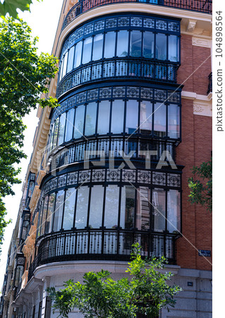 Typical balcony of Madrid with iron and glass coverage 104898564