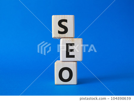 SEO - Search Engine Optimization symbol. Wooden blocks with words SEO. Beautiful blue background. Business and SEO concept. Copy space. SEO - Search Engine Optimization symbol. Wooden blocks with words SEO. Beautiful blue background. Business and SEO concept. Copy space. 104898639