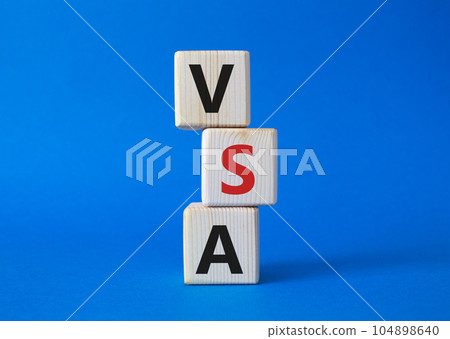 VSA - Volume Spread Analysis symbol. Wooden cubes with word VSA. Beautiful blue background. Business and Volume Spread Analysis concept. Copy space. 104898640