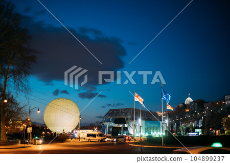 Tbilisi, Georgia. Scenic View Of Park Rike In Tbilisi, Georgia. Air Balloon Viewpoint, Cableway. Evening Scenic View Of City Center In Lighting. Official Residence Of Georgian President On Background 104899237