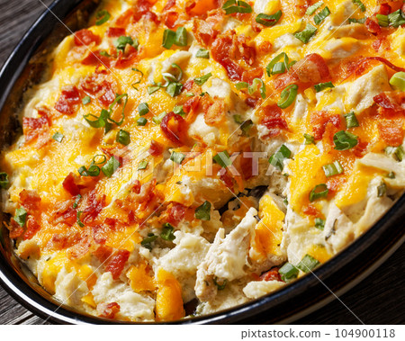 chicken bake in creamy sauce with cheese, bacon 104900118