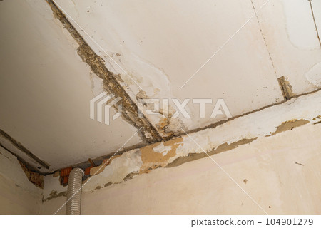 Damage ceiling from water pipelines leakage. Housing problem concept Damage ceiling from water pipelines leakage. Housing problem concept 104901279