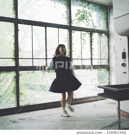 High school girls dancing in the corridor High school girls dancing in the corridor 104901488