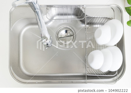 A clean kitchen sink that is clean and shiny A clean kitchen sink that is clean and shiny 104902222