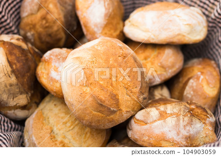 ruddy rolls of fresh warm grain bread 104903059