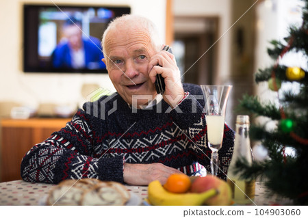 Elderly pensioner wishes Merry Christmas on the phone Elderly pensioner wishes Merry Christmas on the phone 104903060