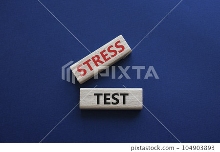 Stress test symbol. Wooden blocks with words Stress test. Beautiful deep blue background. Business and Stress test concept. Copy space. 104903893
