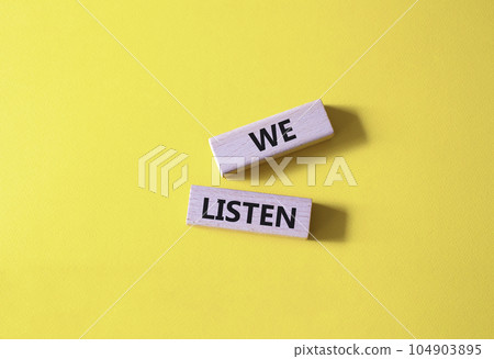 We listen symbol. Wooden blocks with words We listen. Beautiful yellow background. Business and We listen concept. Copy space. We listen symbol. Wooden blocks with words We listen. Beautiful yellow background. Business and We listen concept. Copy space. 104903895