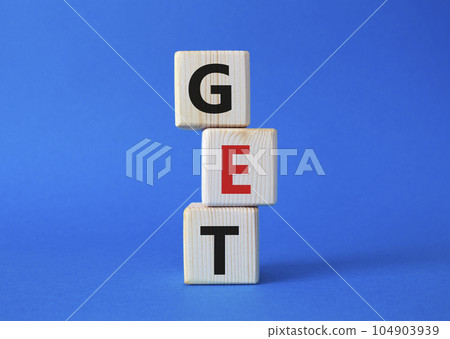 GET symbol. Concept word GET on wooden cubes. Beautiful blue background. Business and GET concept. Copy space. 104903939
