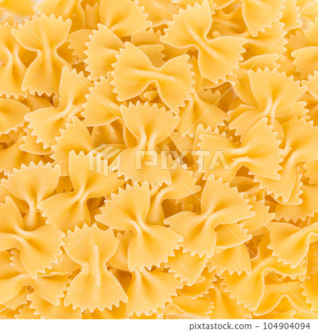Uncooked farfalle pasta 104904094