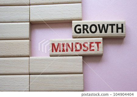 Growth Mindset symbol. Concept word Growth Mindset on wooden blocks. Beautiful pink background. Business and Growth Mindset concept. Copy space Growth Mindset symbol. Concept word Growth Mindset on wooden blocks. Beautiful pink background. Business and Growth Mindset concept. Copy space 104904404