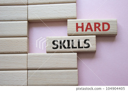 Hard skills symbol. Wooden blocks with words Hard skills. Beautiful pink background. Business and Hard skills concept. Copy space. Hard skills symbol. Wooden blocks with words Hard skills. Beautiful pink background. Business and Hard skills concept. Copy space. 104904405
