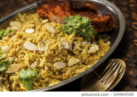 Tandoori chicken and biryani 104904590