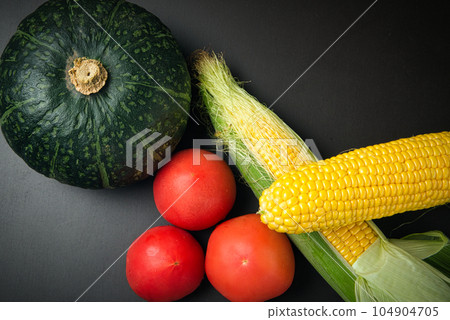 Fresh summer vegetables pumpkin, corn and tomato Fresh summer vegetables pumpkin, corn and tomato 104904705
