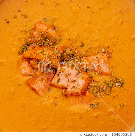 Carrot, pumpkin cream soup with salmon Carrot, pumpkin cream soup with salmon 104905368
