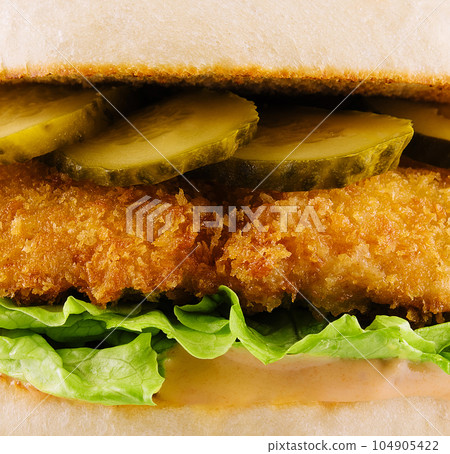 burger with nuggets and pickled cucumbers 104905422