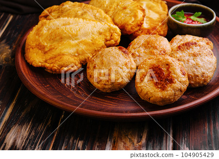 meatballs and fried chicken chops on plate 104905429