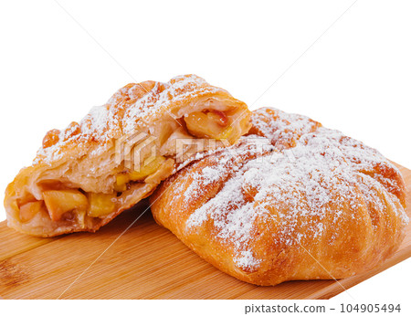 Baking puff pastry vertuta with apple or strudel Baking puff pastry vertuta with apple or strudel 104905494