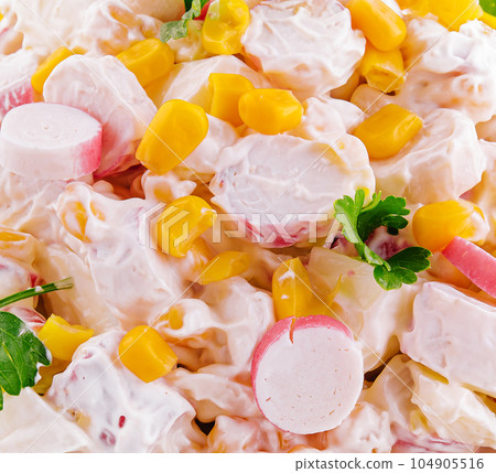 Salad of chopped crab sticks with sweet corn 104905516