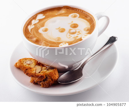 White cup cappuccino coffee with a latte-art pattern in the form of a bear White cup cappuccino coffee with a latte-art pattern in the form of a bear 104905877