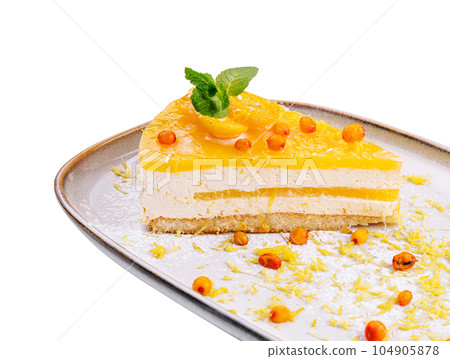Cheesecake with orange chips on plate Cheesecake with orange chips on plate 104905878