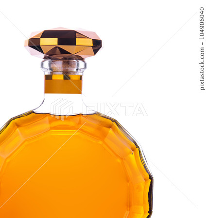 Bottle of cognac isolated on white Bottle of cognac isolated on white 104906040