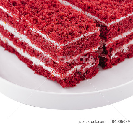 two slices red velvet cake on plate 104906089