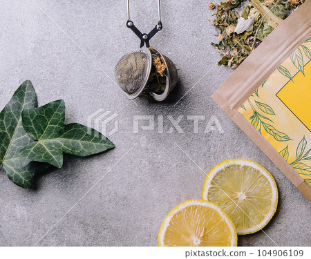 Lemon slices and tea packaging top view 104906109