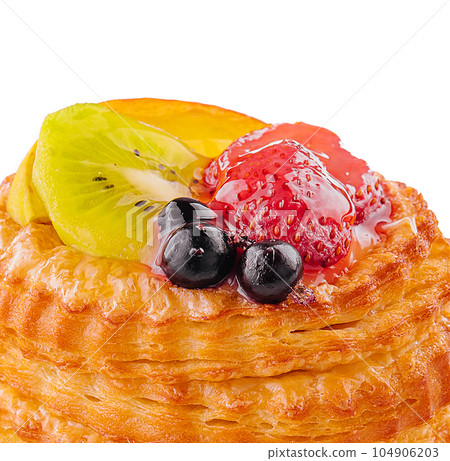 Fresh delicious puff pastry with sweet berries Fresh delicious puff pastry with sweet berries 104906203