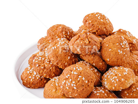 sweet cookies with sesame seeds in plate sweet cookies with sesame seeds in plate 104906205