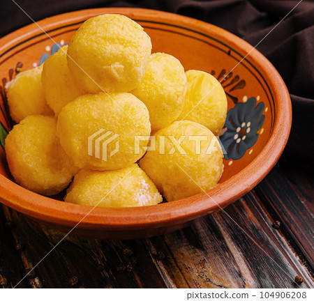cheese balls with garlic inside in bowl cheese balls with garlic inside in bowl 104906208
