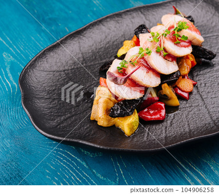 Roasted duck breast with vegetables in fruit sauce Roasted duck breast with vegetables in fruit sauce 104906258