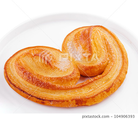 Palmier a french puff pastry in palm leaf shape Palmier a french puff pastry in palm leaf shape 104906393