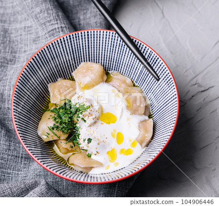 boiled and fried dumplings with sour cream and herbs boiled and fried dumplings with sour cream and herbs 104906446