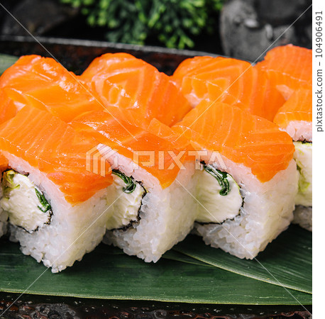 Salmon sushi with rice on stone plate 104906491