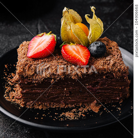 Piece of Chocolate Napoleon cake close up Piece of Chocolate Napoleon cake close up 104906668