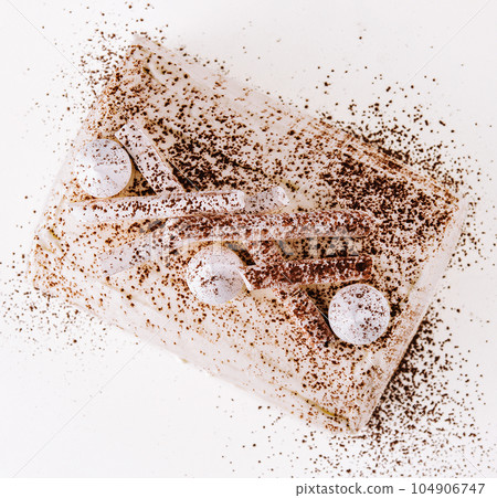 White whipped cream cake on white plate 104906747