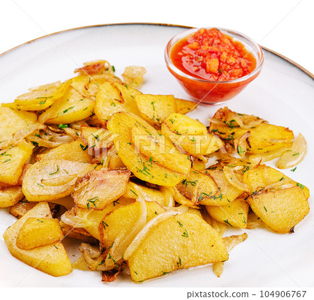 fried potatoes with onions with parsley and sauce fried potatoes with onions with parsley and sauce 104906767